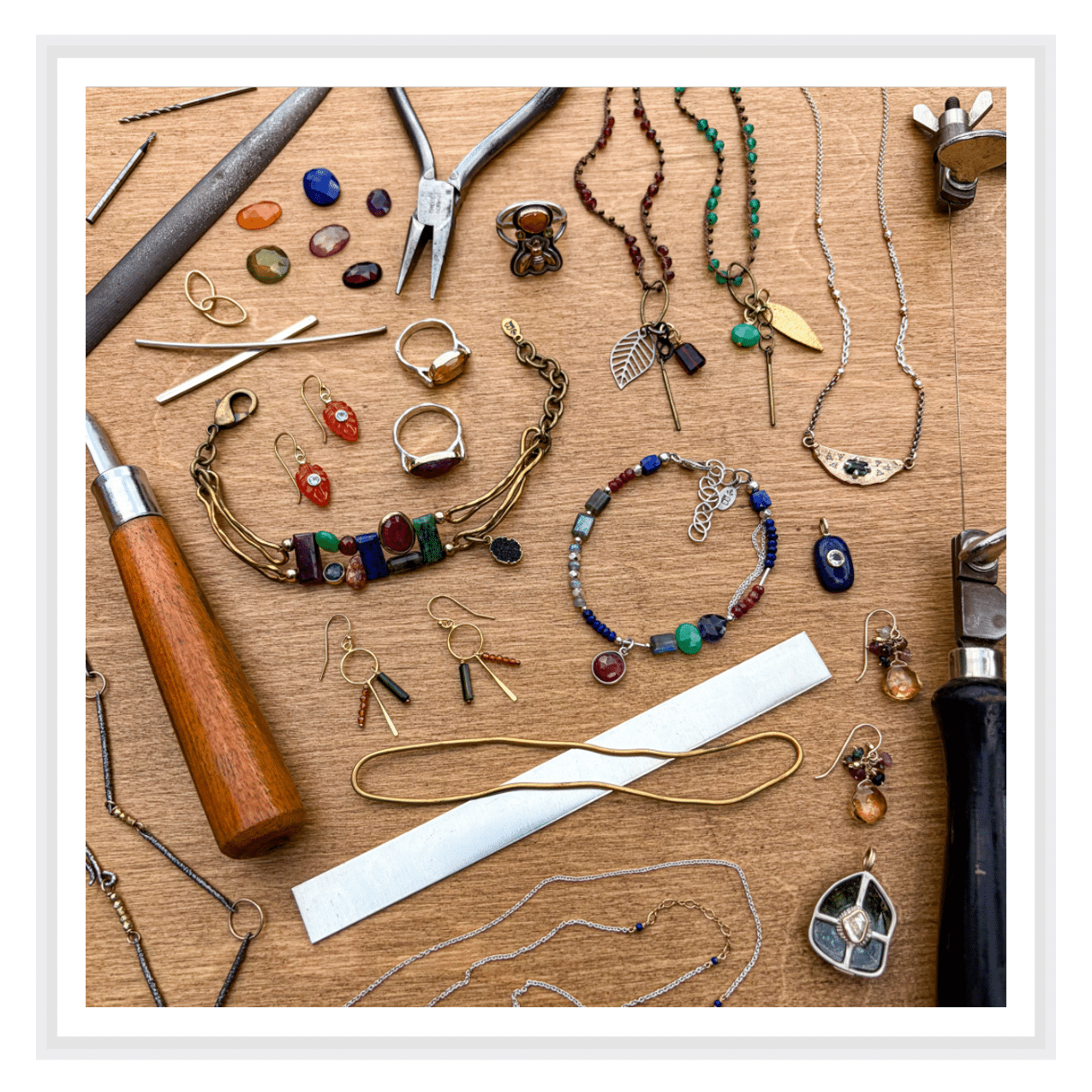 Stumpcraft Puzzle - Burlap Sac jewellery and jewellery making tools on a wood background